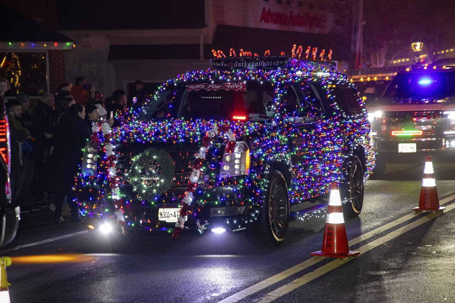 Santa arrived at the Hampton Bays firehouse after a parade through town on Saturday carolers performed and the tree was lighted.   MICHAEL O'CONNOR