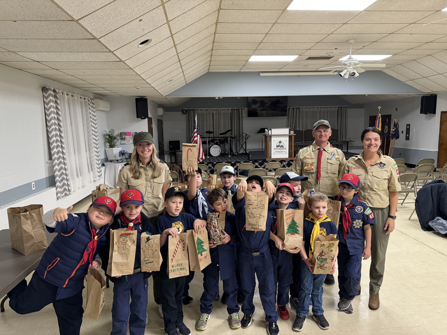 Hampton Bays Pack 483 participated in its annual tradition of making personalized decorated gift bags filled with necessities and treats for the homeless clients of Maureen's Haven. They gathered on December 14 at the Anderson Warner Hall in Hampton Bays to fill the bags with the donated items. COURTESY PACK 483