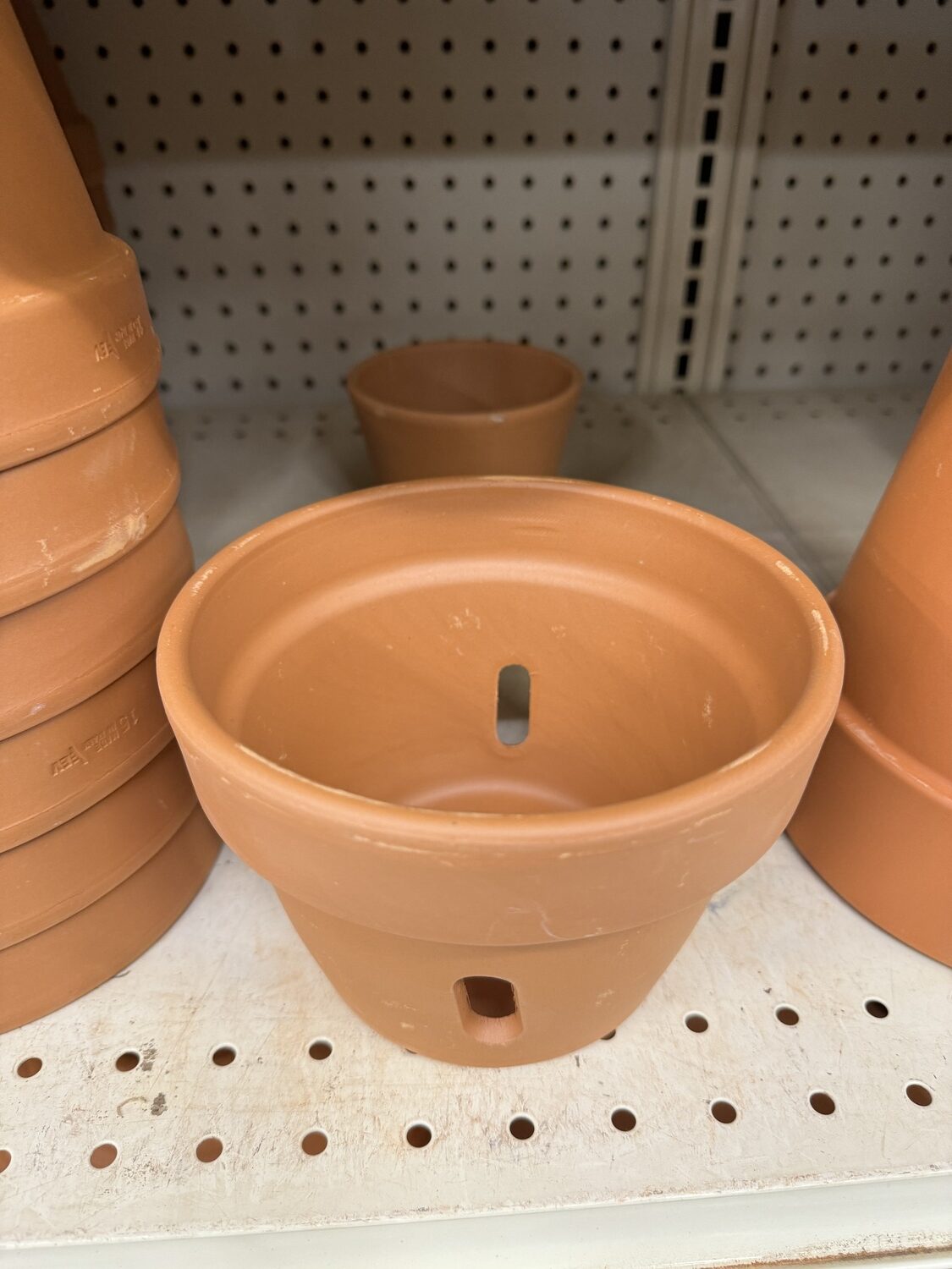 Orchids and a few other plants don’t do well without perfect drainage. This slotted clay pots allows air into the root zone so moisture can leave the pot and moist air can freely circulate in the root area.
ANDREW MESSINGER
