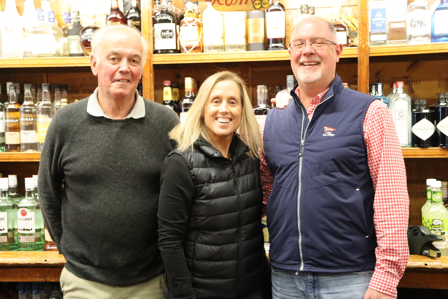 From left, John Rist, Michelle Reilly and John Noonan. The three business partners operate Herbert and Rist Liquor Store, celebrating its 90th anniversary this year. CAILIN RILEY