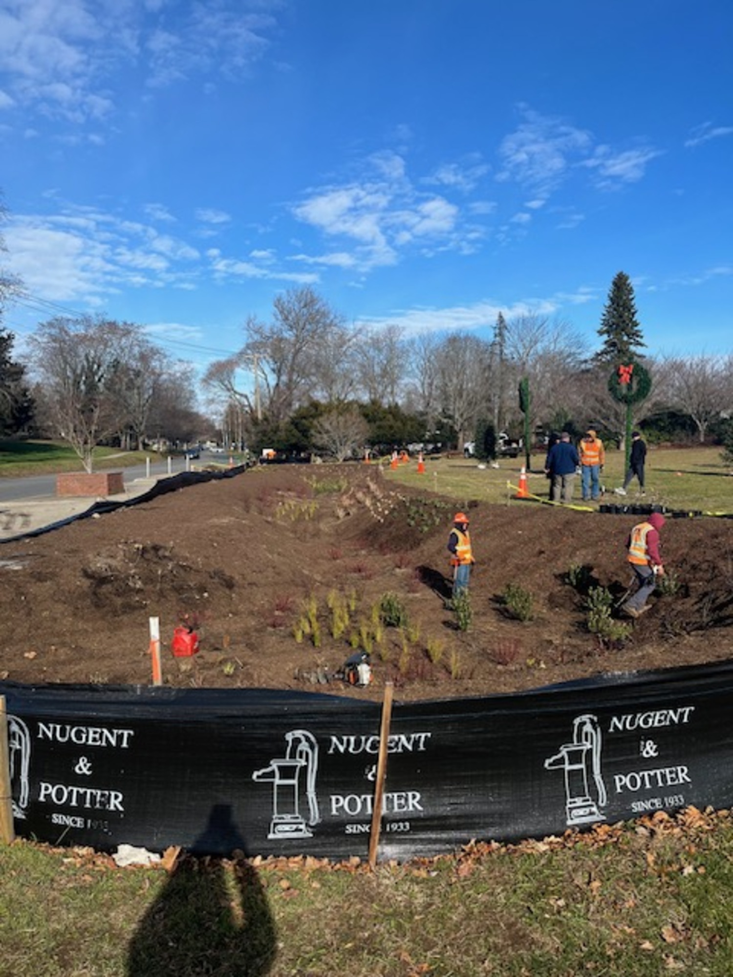 A newly installed bioswale at the corner of Windmill Lane and Nugent Street will help filter stormwater runoff and improve the health of Lake Agawam. It was installed on December 7, and paid for by more than $180,000 in grant funding from the town and county. KAREN BONTEMPO