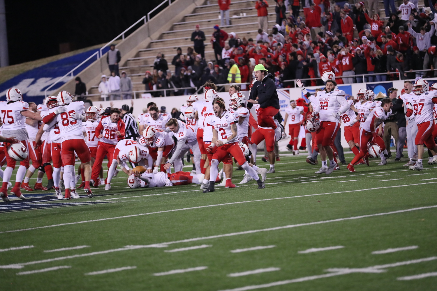 Jaden AlfanoStJohn runs onto the field with his teammates after their 38-37 victory over North Central for the NCAA Division III Championship.   DARL ZEHR PHOTOGRAPHY