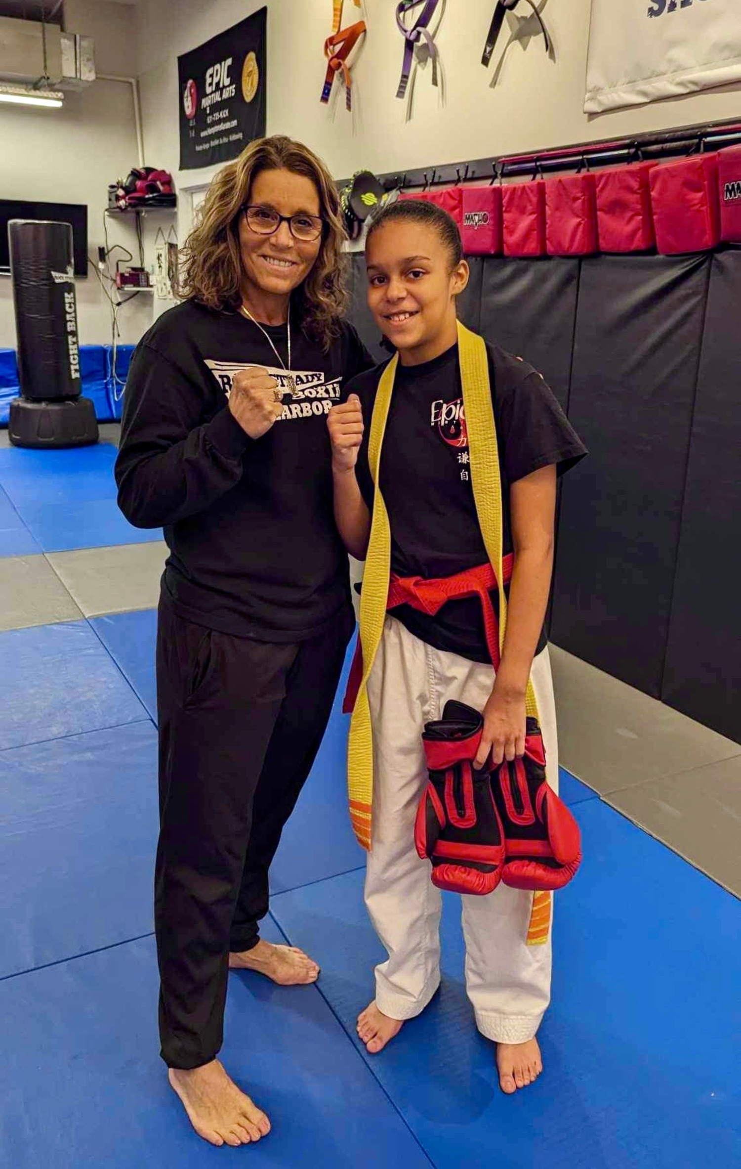 Sensei Michelle Del Giorno with her student, Delaney Smith, who recently earned her orange belt at Epic Martial Arts in Sag Harbor. COURTESY MICHELLE DEL GIORNO