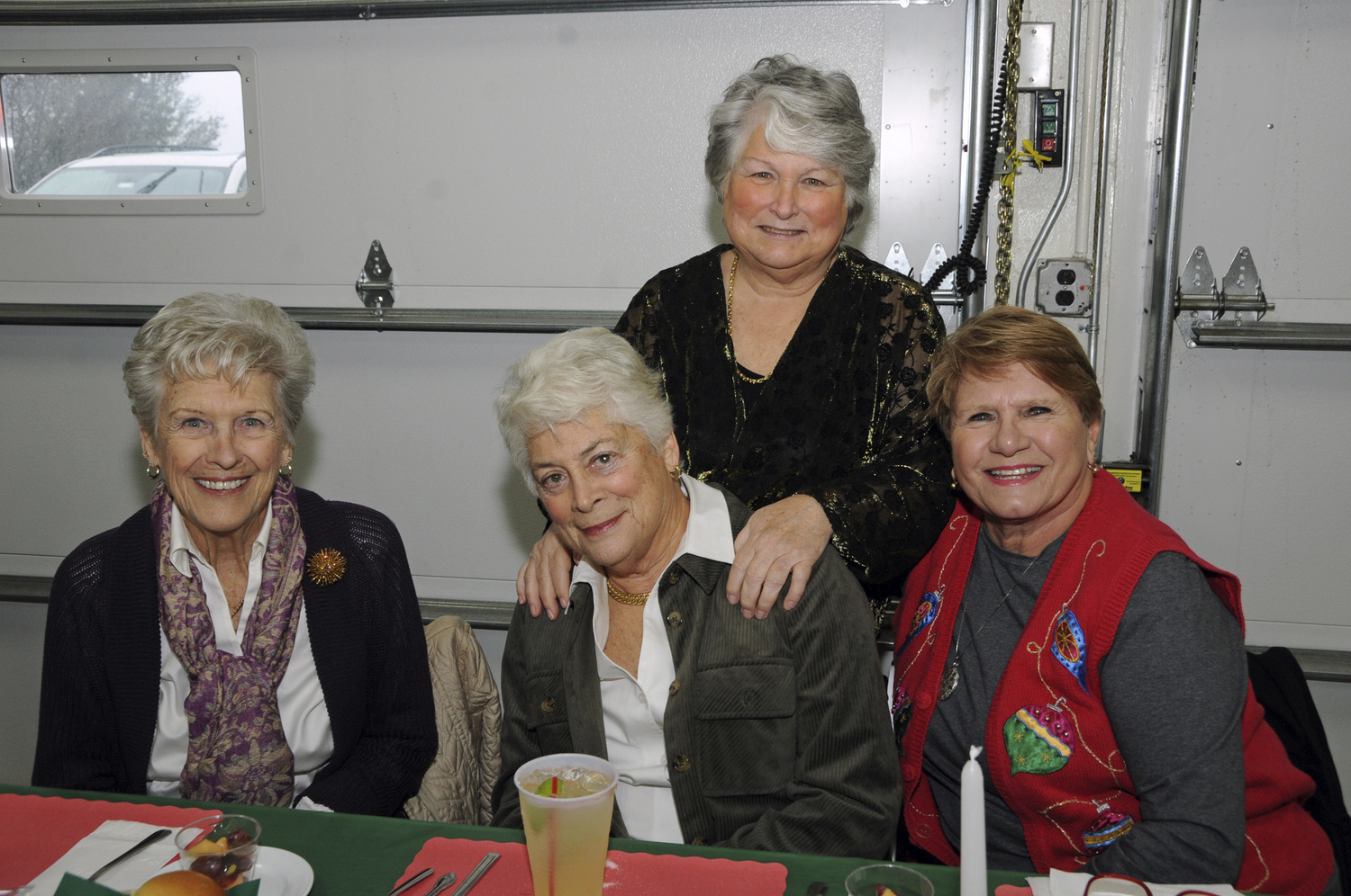 Sharon Sennefelder, Iris Mitchell, Vivienne Wilkinson and Chrissy Herbert at the Montauk Fire Department's annual Holiday Senior Dinner on Sunday.  RICHARD LEWIN
