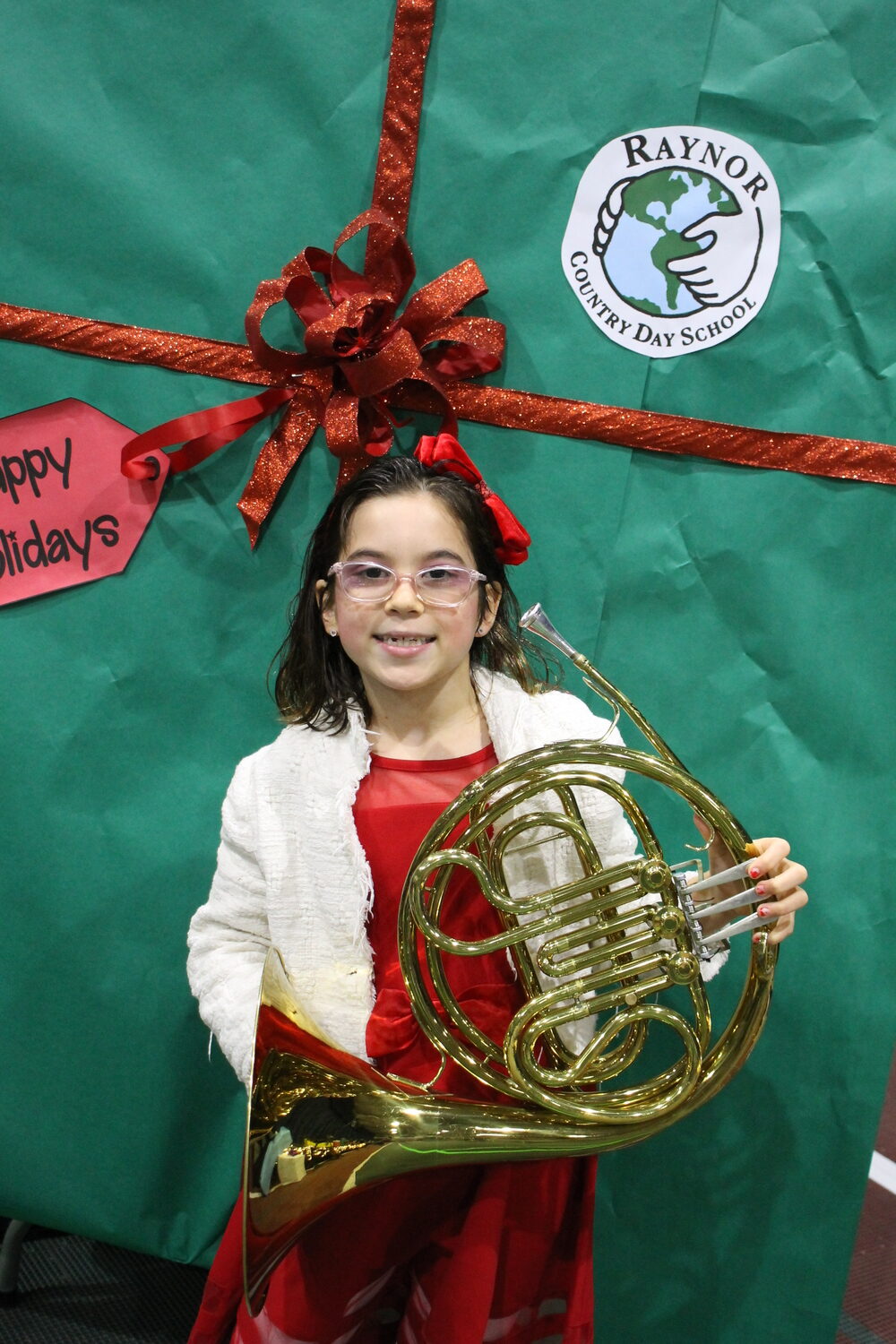 First. second and third grade students at Raynor Country Day School celebrated the season with their first winter concert of the year last week. Third grade student Ava Pratley-Teich prepares for her debut in the Beginner Band. COURTESY RAYNOR COUNTRY DAY SCHOOL