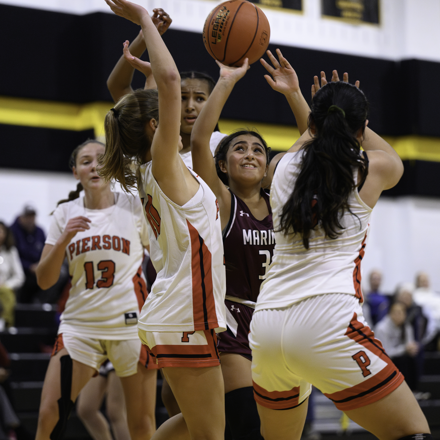 Freshman Domenica Davis shoots in traffic. MARIANNE BARNETT