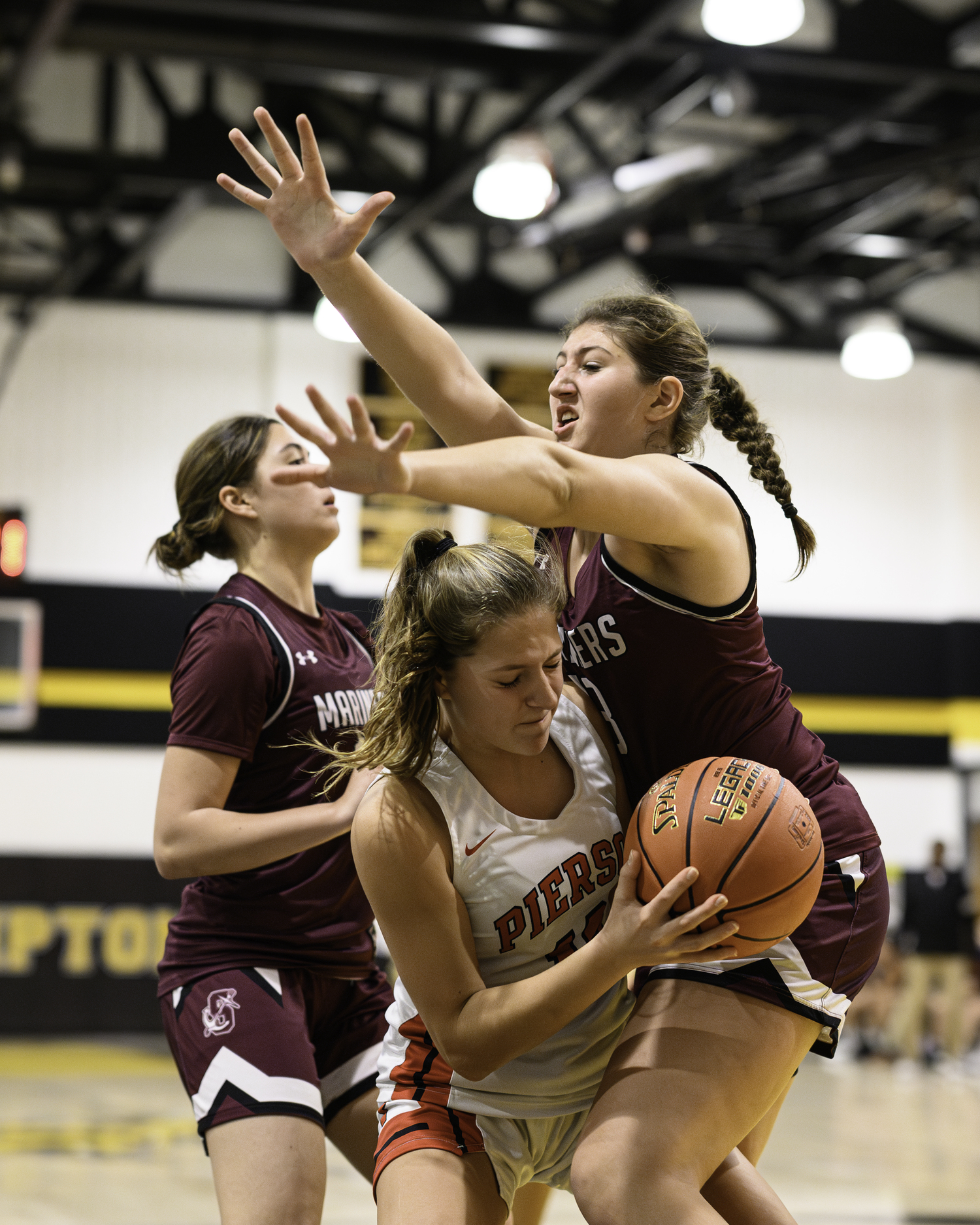 Freshman Marin Schwartz reaches for a block. MARIANNE BARNETT