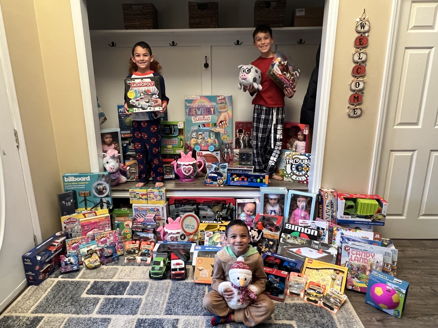 Hunter, Greyson and Michael Davis collected toys for children in the community. COURTESY EASTPORT-SOUTH MANOR SCHOOL DISTRICT