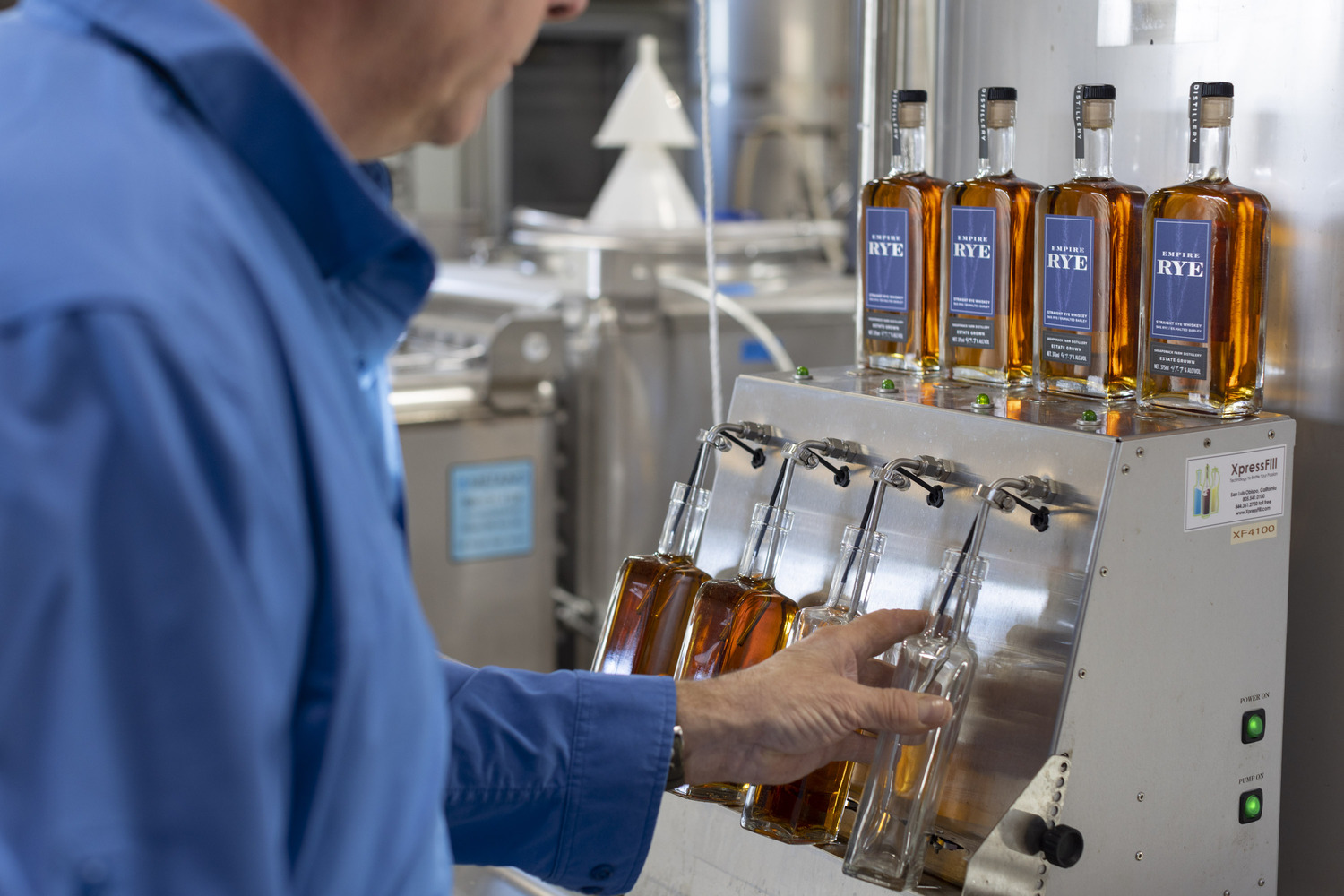 Sagaponack Farm Disillery's head distiller Matt Beamer fills bottles of Empire Rye. JOHN MUSNICKI