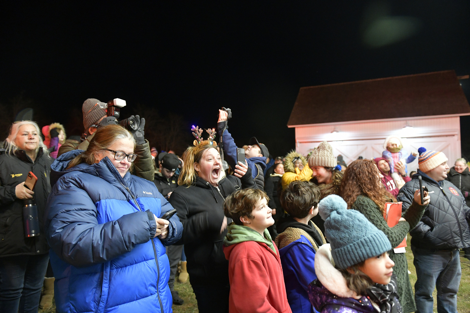 The crowd reacts to the lighting of the Big Duck on November 29 in Flanders.   DANA SHAW