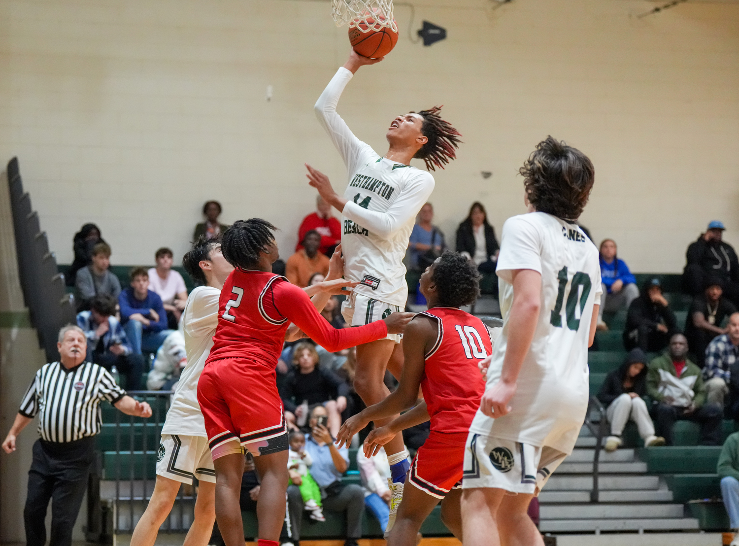 Junior center Jorden Bennett reaches for the rim. RON ESPOSITO