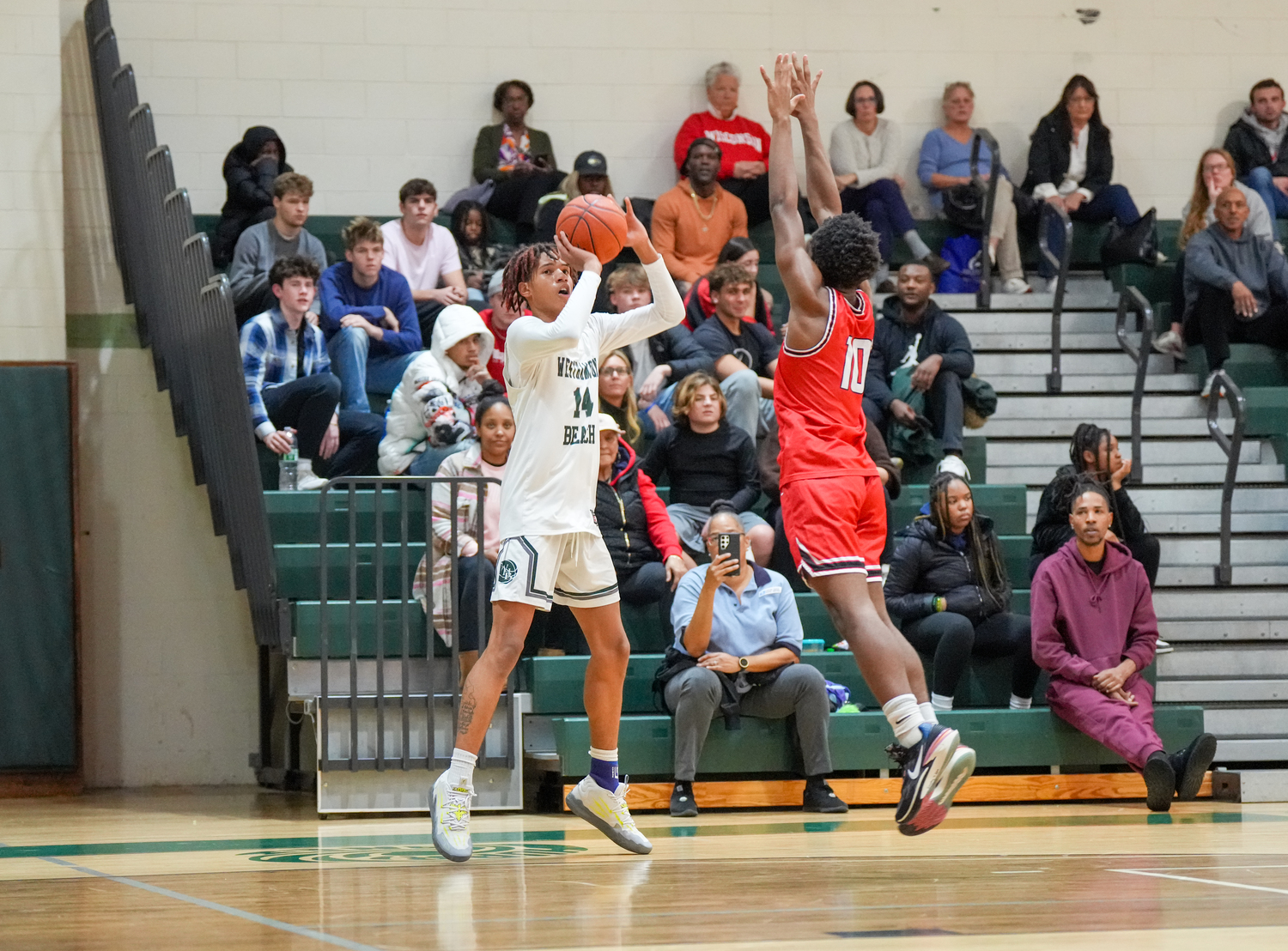 Junior center Jorden Bennett shoots from outside. RON ESPOSITO