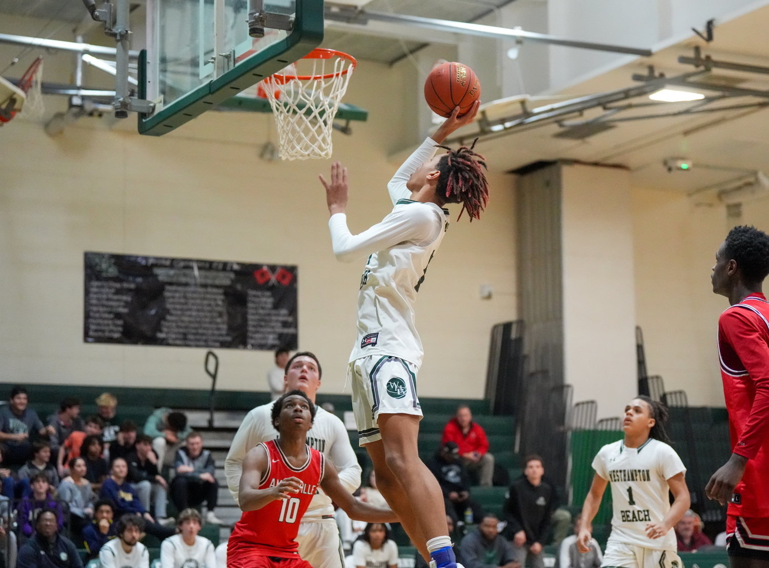 Junior center Jorden Bennett collects two of his game-high 29 points. RON ESPOSITO
