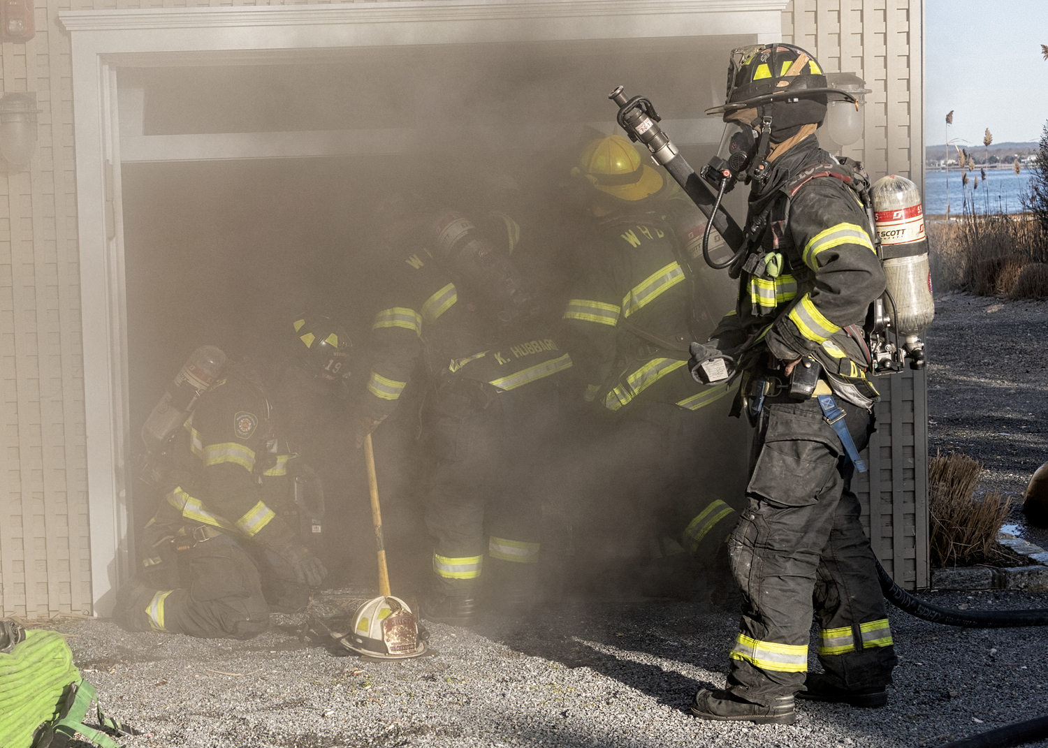 Firefighters on the scene of a house fire in the 800 block of Dune Road on Friday, December 22.  COURTESY WESTHAMPTON BEACH FIRE DEPARTMENT