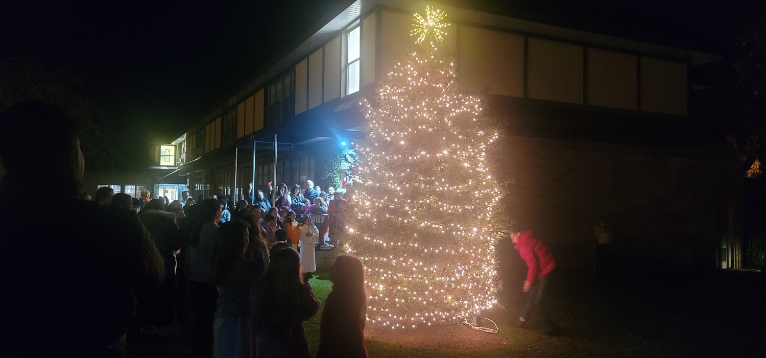 Members of the community gathered for the lighting of the outdoor Christmas tree at Our Lady of the Hamptons School last week. COURTESY OUR LADY OF THE HAMPTONS SCHOOL
