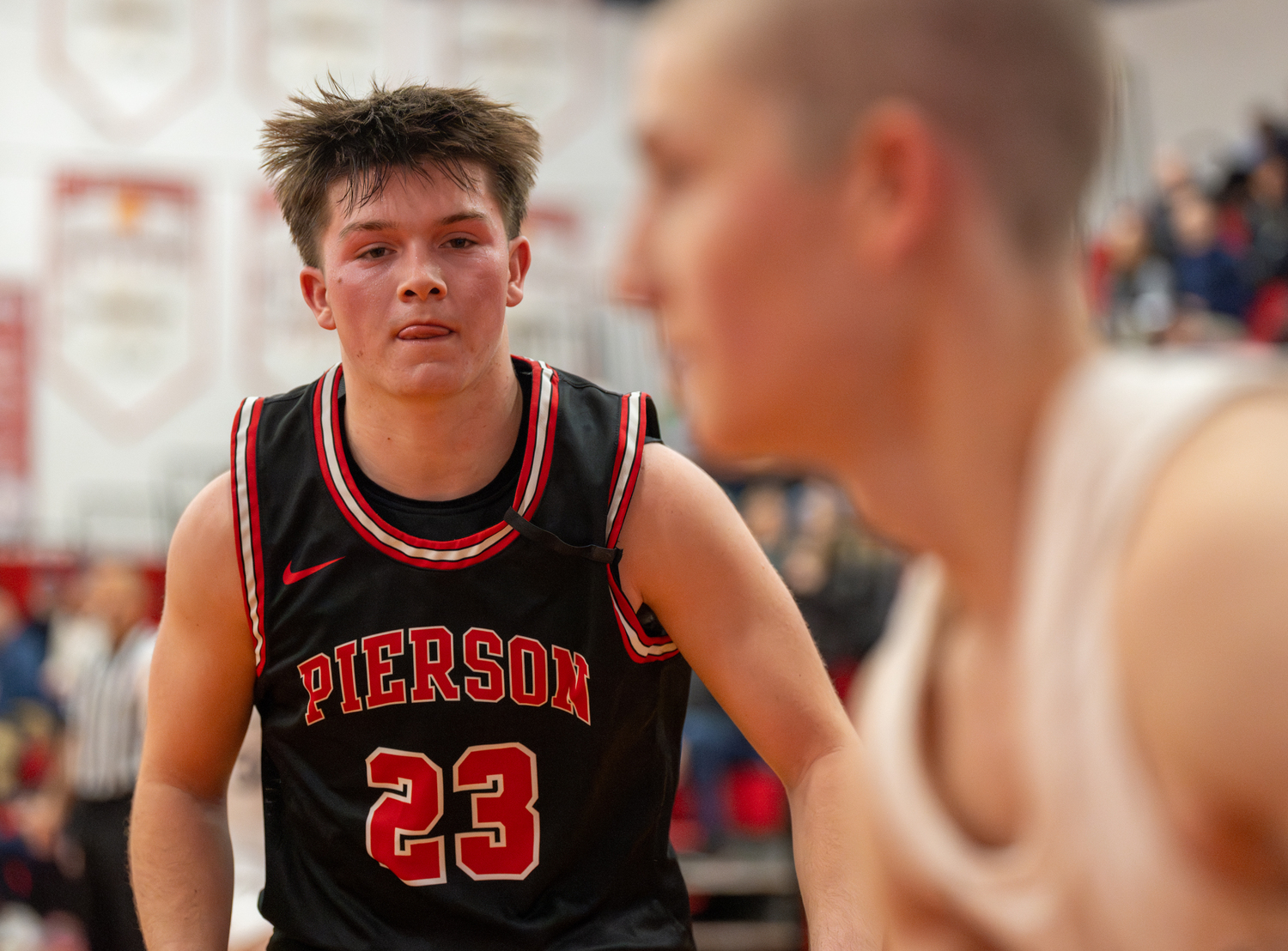 Pierson senior Aidan Schmitz keeps an eye on the Northport player he's tracking.   RON ESPOSITO