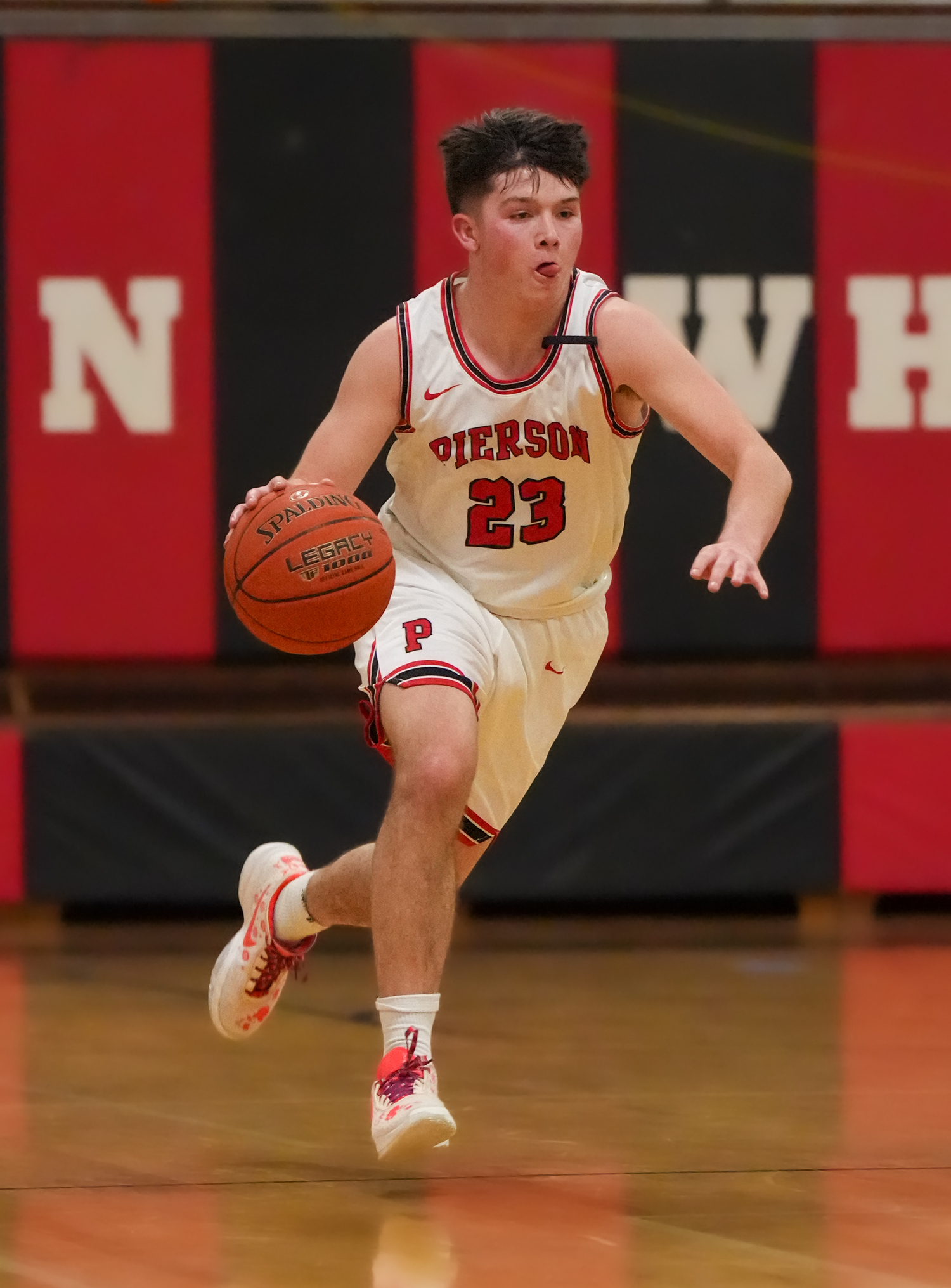 Pierson senior Aidan Schmitz brings the ball down the court.   RON ESPOSITO