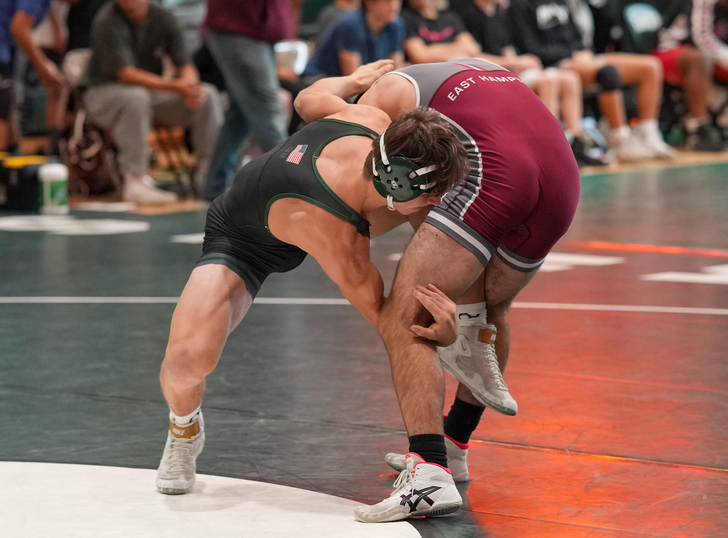 Westhampton Beach freshman Andrew Lewis and East Hampton's Justin Prince tie up.   RON ESPOSITO