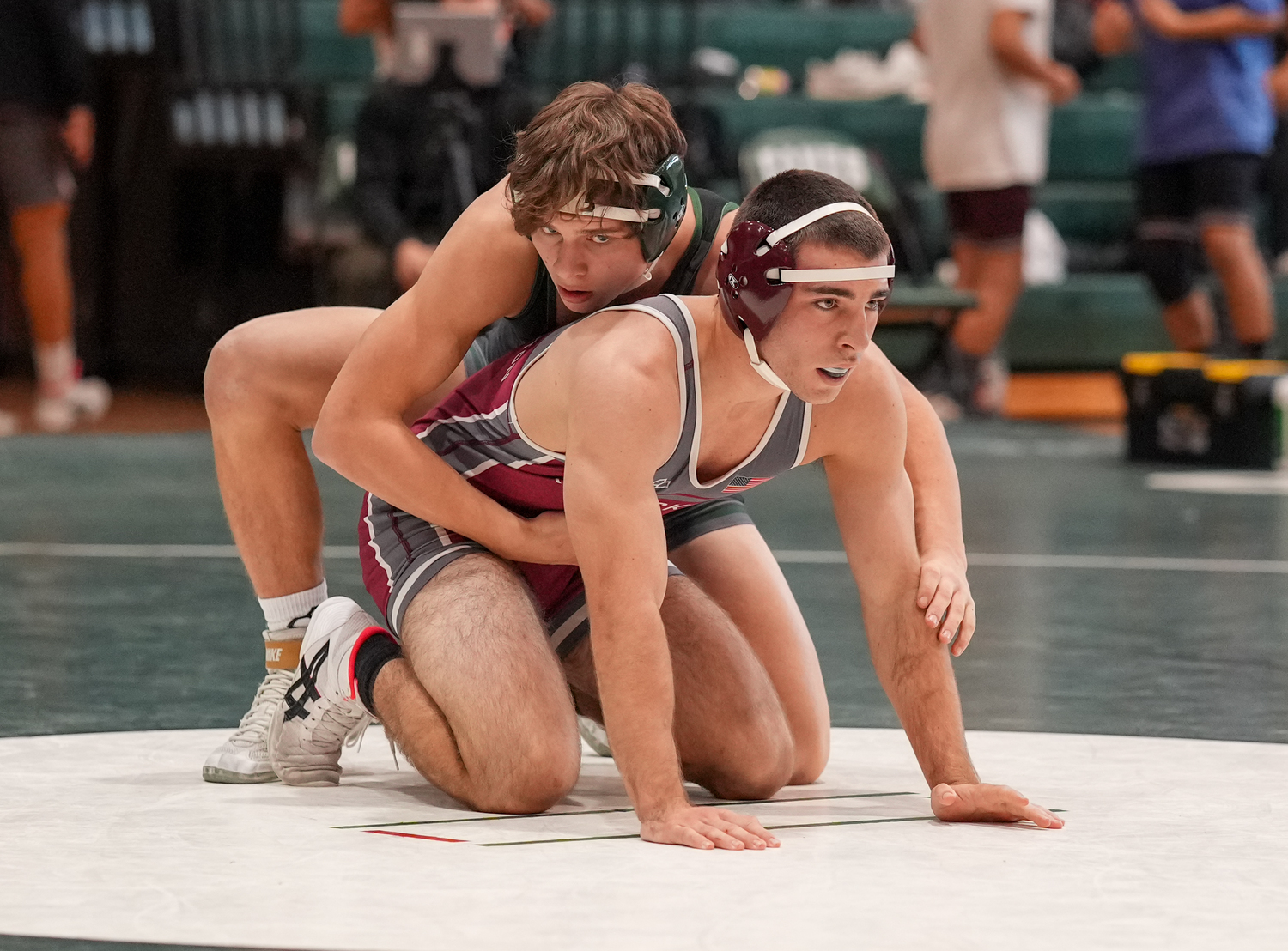 Andrew Lewis waits for the whistle while wrestling Justin Prince.   RON ESPOSITO