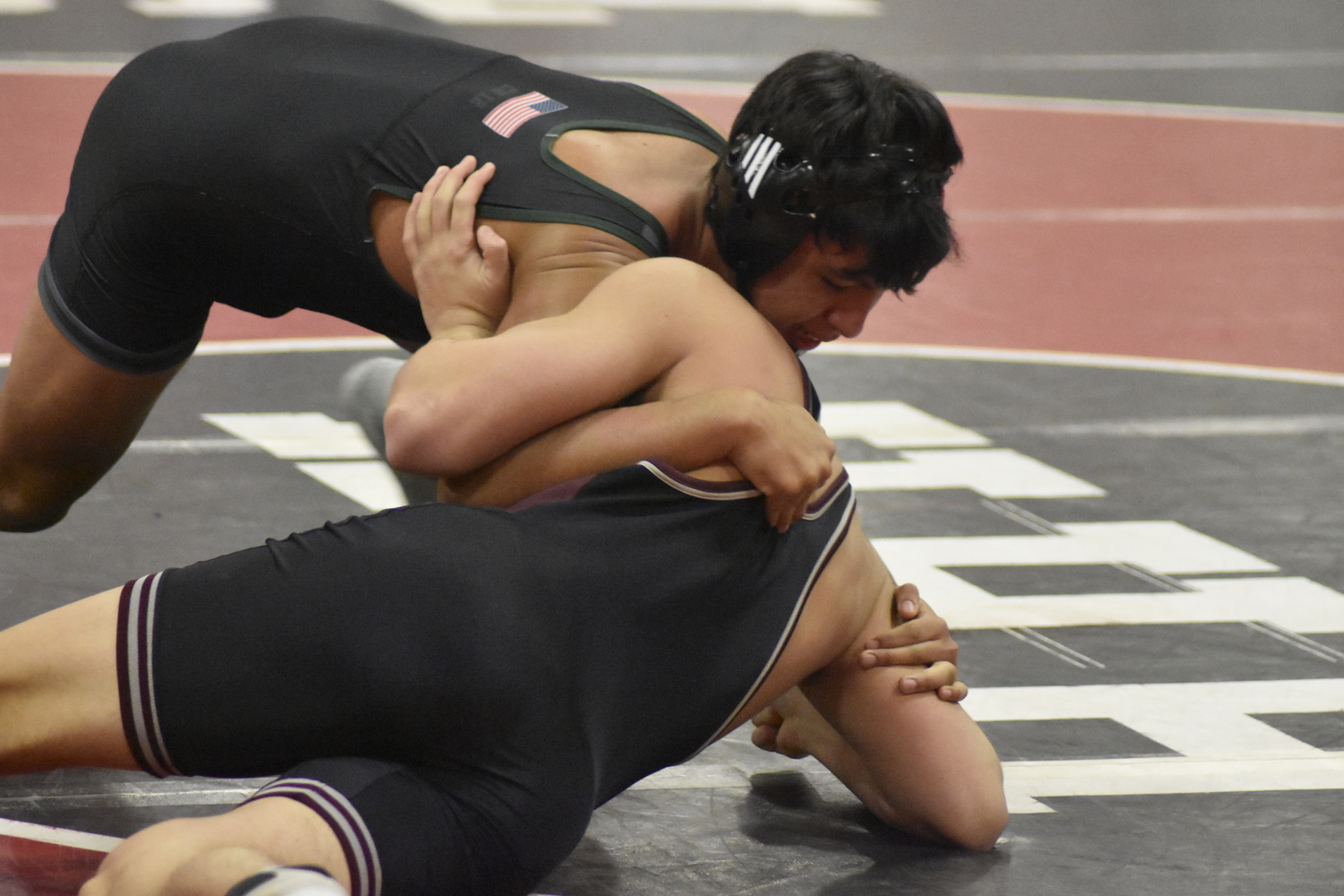 Hurricane Fernando Osorio works on pinning his opponent.  DREW BUDD