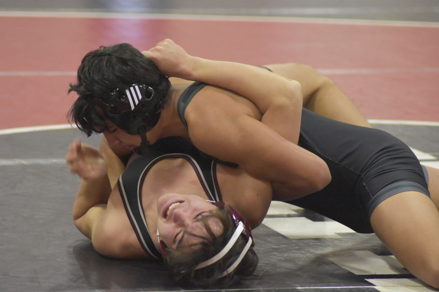 Hurricane Fernando Osorio works on pinning his opponent.  DREW BUDD