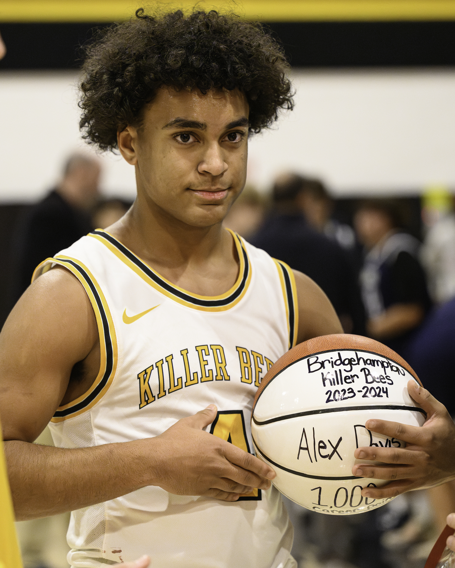 Bridgehampton sophomore Alex Davis with his career 1,000 point ball.   MARIANNE BARNETT