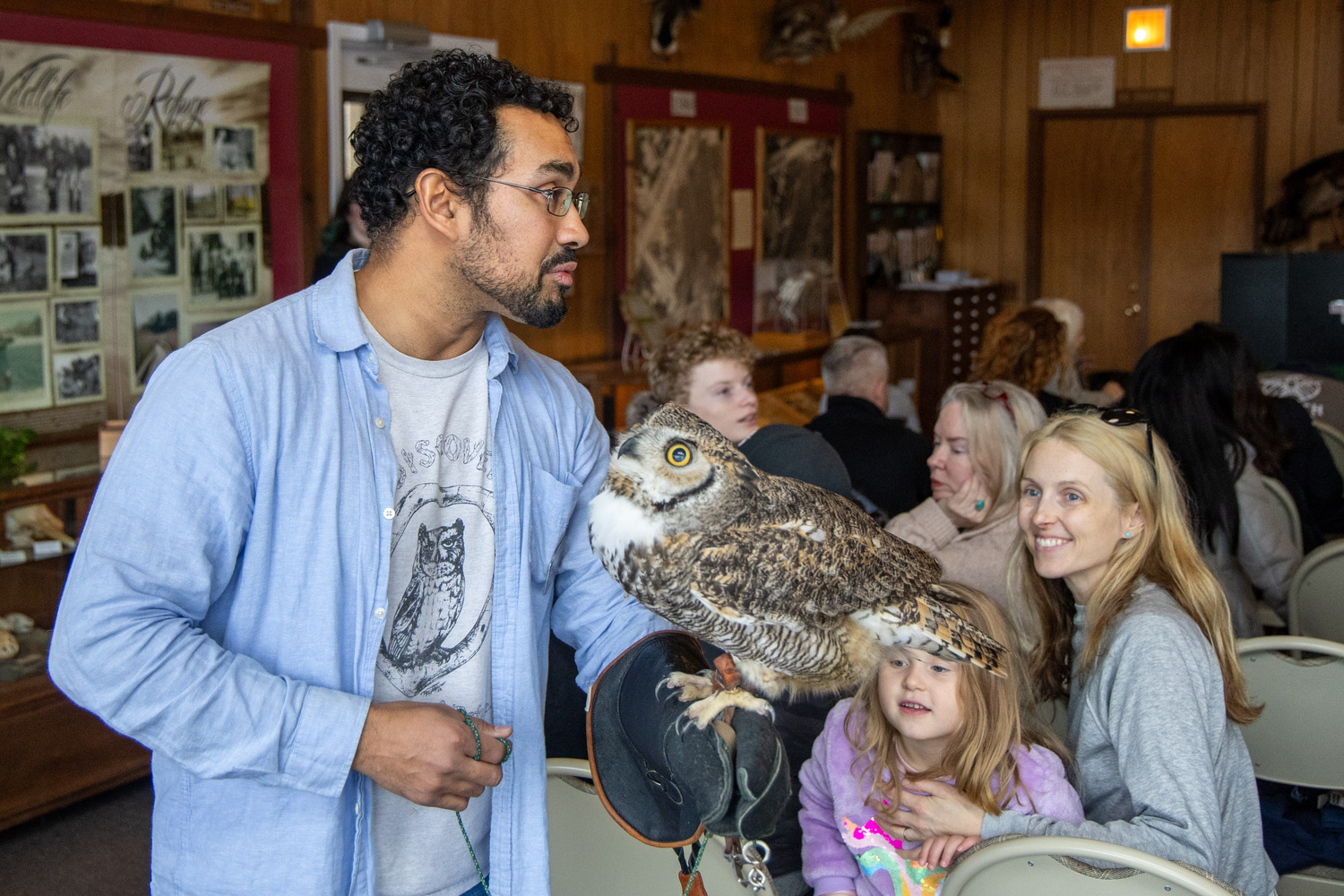 Environmental educator Tony Valderrama talked about birds of prey at the Quogue Wildlife Refuge on Saturday using animals currently at the refuge such as a hawk named Moxy, another named Red, and an owl named Hooter. MICHAEL O'CONNOR