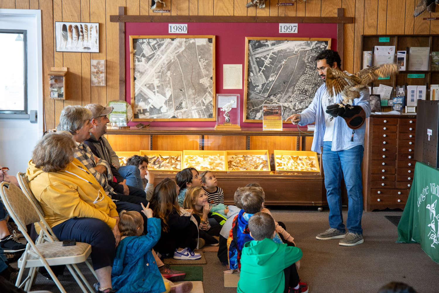 Environmental educator Tony Valderrama talked about birds of prey at the Quogue Wildlife Refuge on Saturday using animals currently at the refuge such as a hawk named Moxy, another named Red, and an owl named Hooter. MICHAEL O'CONNOR