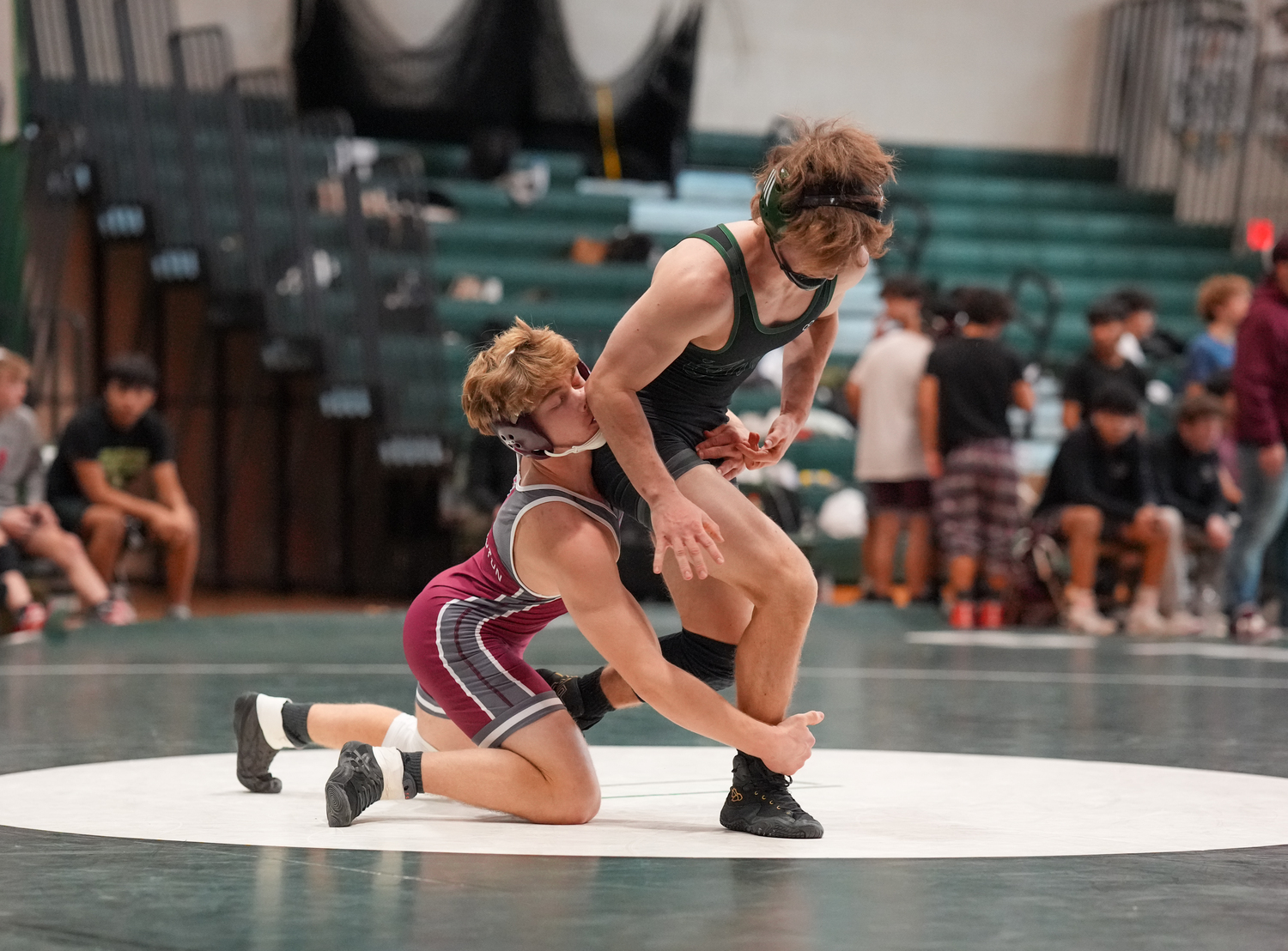 Westhampton Beach senior Bobby Stabile gets out of the grips of East Hampton's Michael Newmark.   RON ESPOSITO