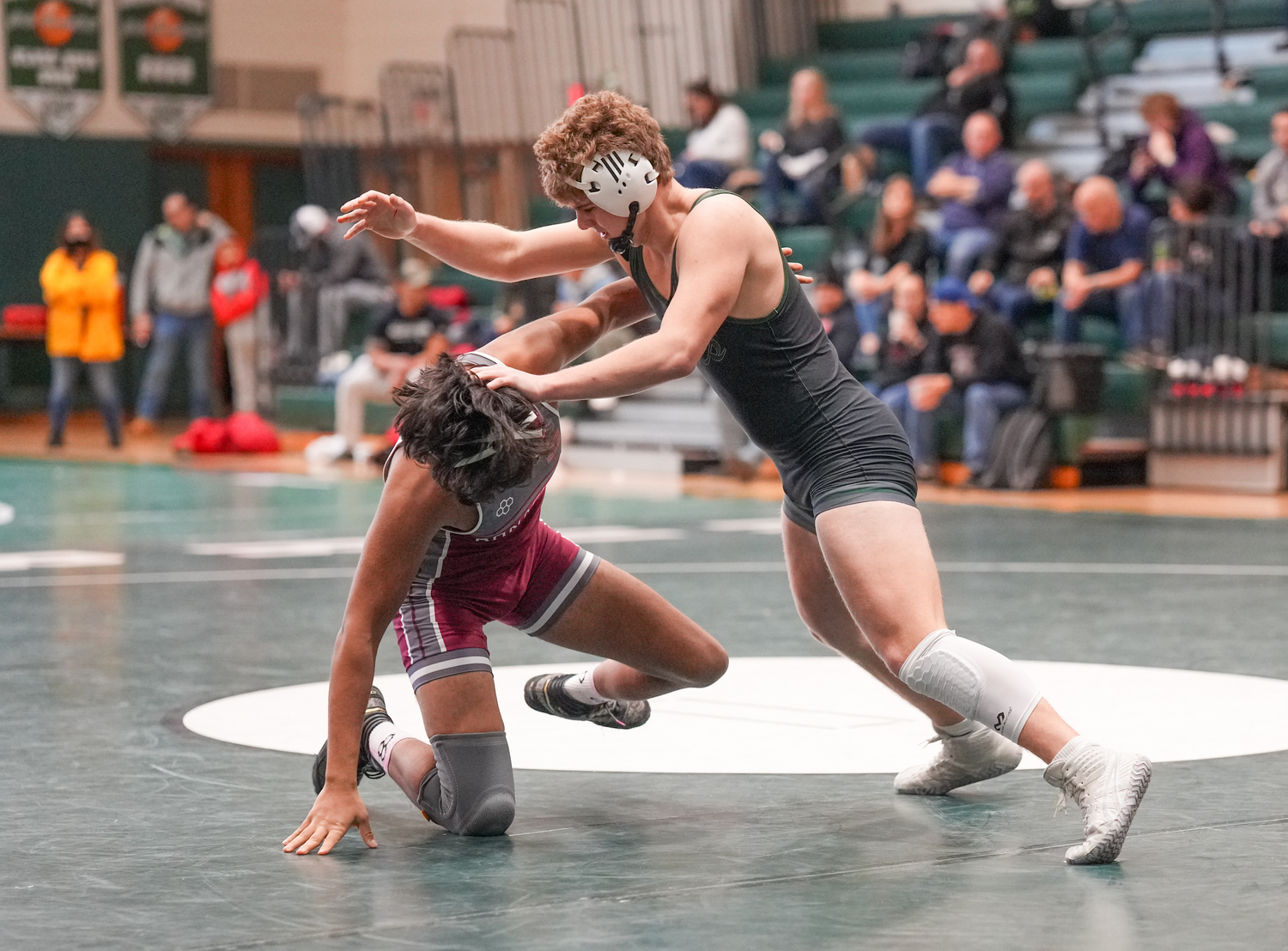 Westhampton Beach senior Connor Rodgers fends off East Hampton senior Aman Chugh.   RON ESPOSITO