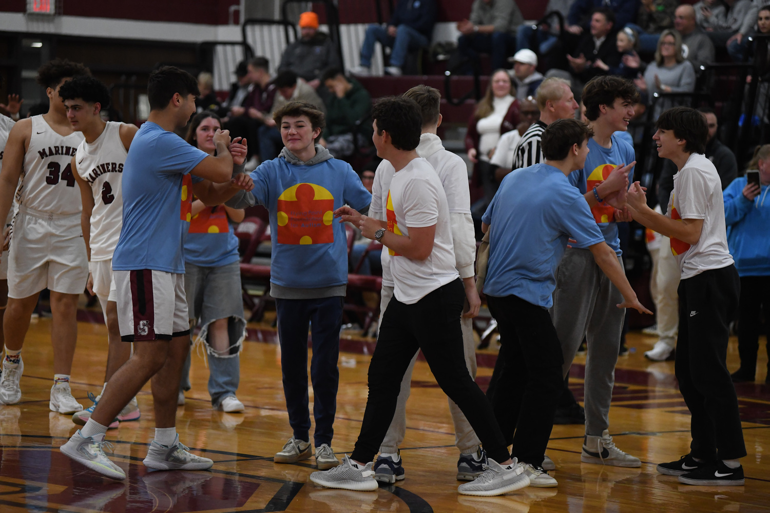 Unified basketball players congratulate one another after the game.   DOUG KUNTZ