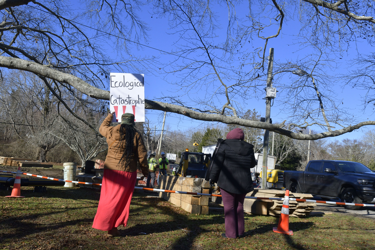 Members of the Shinnecock Nation and the general public gathered at the large, old beech tree at the corner of East Gate Road and Hill Street on Monday in attempts to preserve it from harm.  DANA SHAW