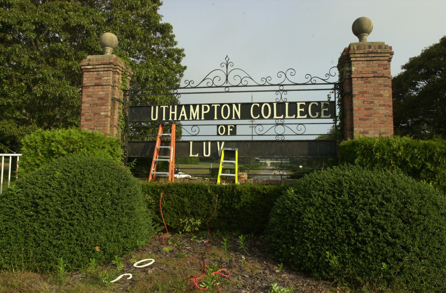 Letters are removed from the Southampton College gate in October of 2006.  DANA SHAW