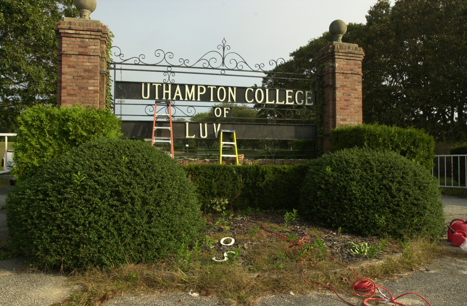 Letters are removed from the Southampton College gate in October of 2006.  DANA SHAW