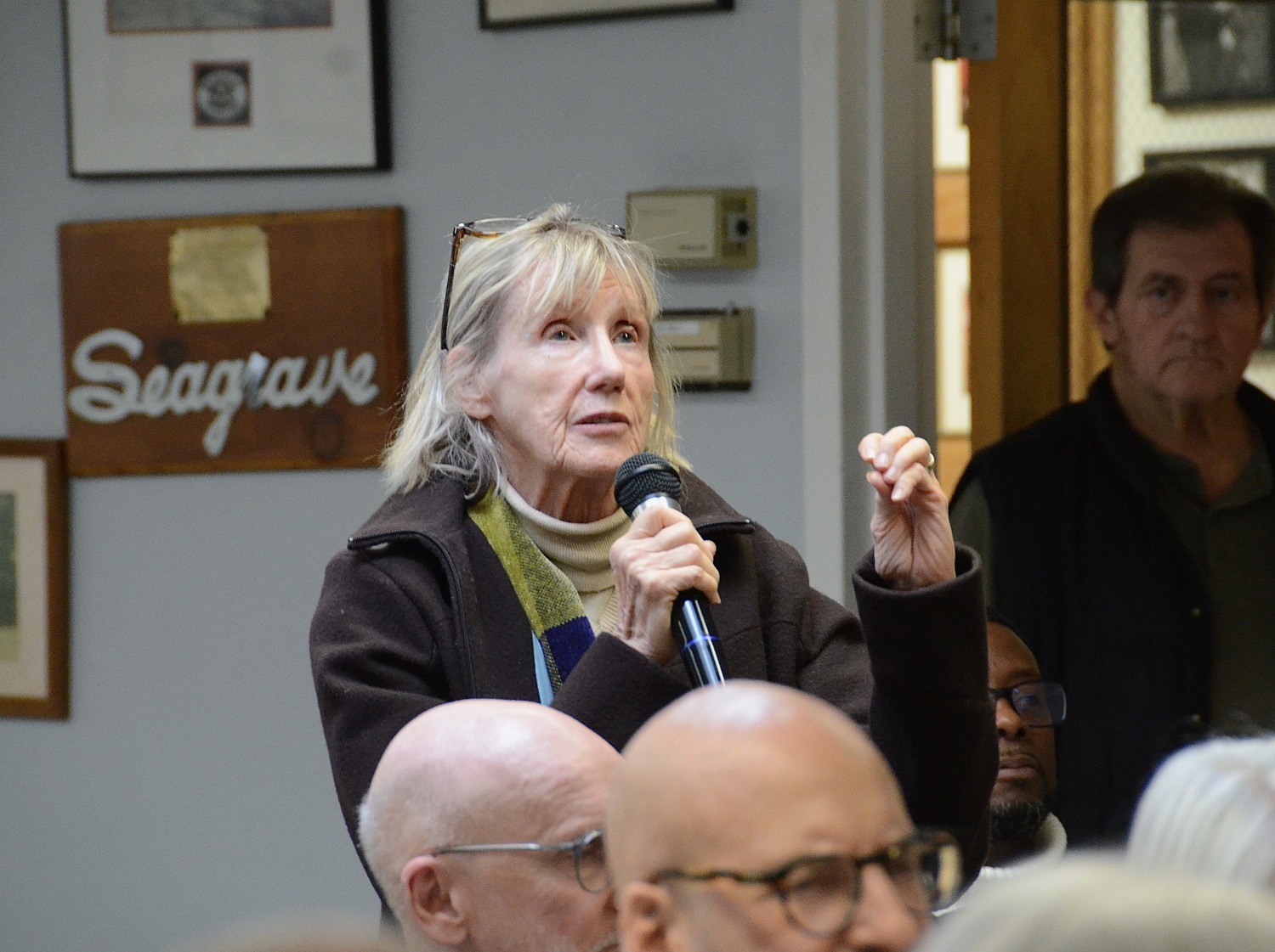 Lorraine Dusky asks a question from the audience at the Sag Harbor Village Board's workshop on affordable housing on Saturday. KYRIL BROMLEY