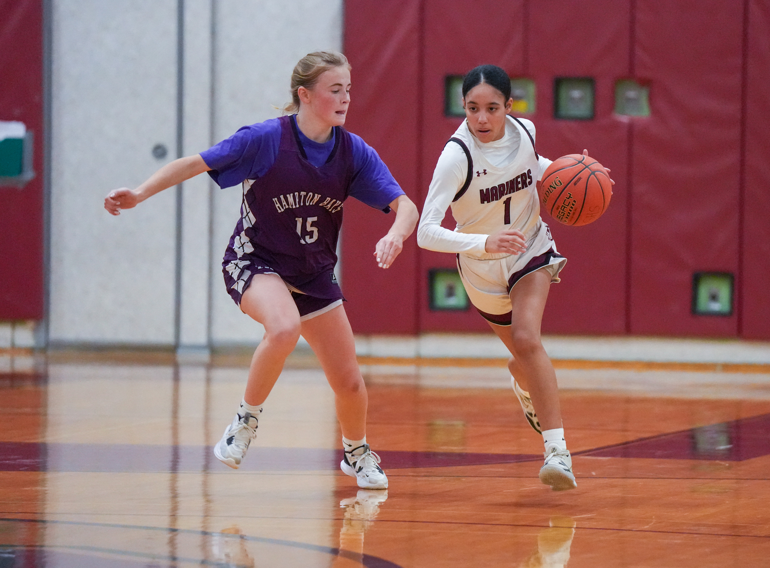 Taylor Meyers of Hampton Bays defends against Southampton's Daelyn Palmore.    RON ESPOSITO/SOUTHAMPTON SCHOOL DSITRICT