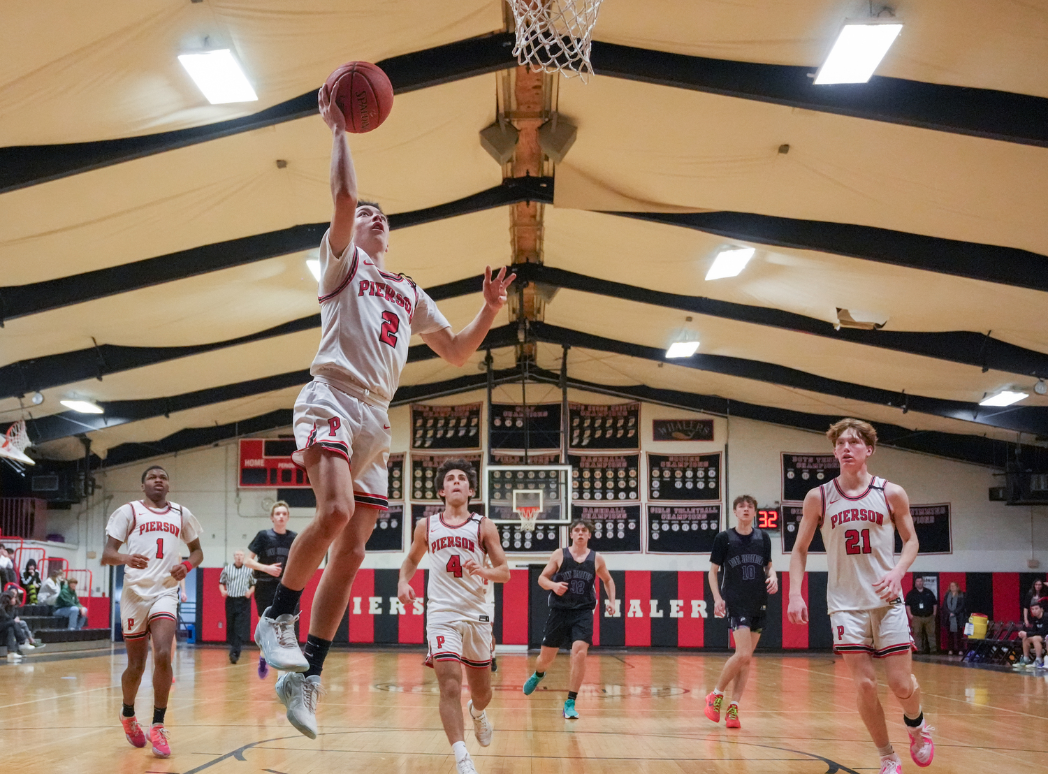 Pierson senior Dom Mancino finishes a fast break with a layup. He scored 14 points in the blowout of Port Jefferson last week.   RON ESPOSITO