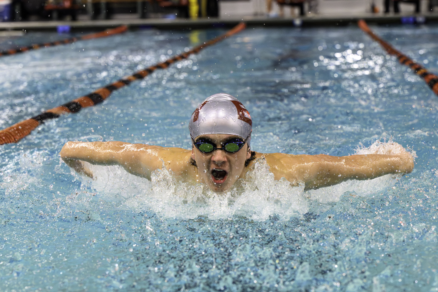 East Hampton senior Emmet McCormac swims the butterfly. MARIANNE BARNETT