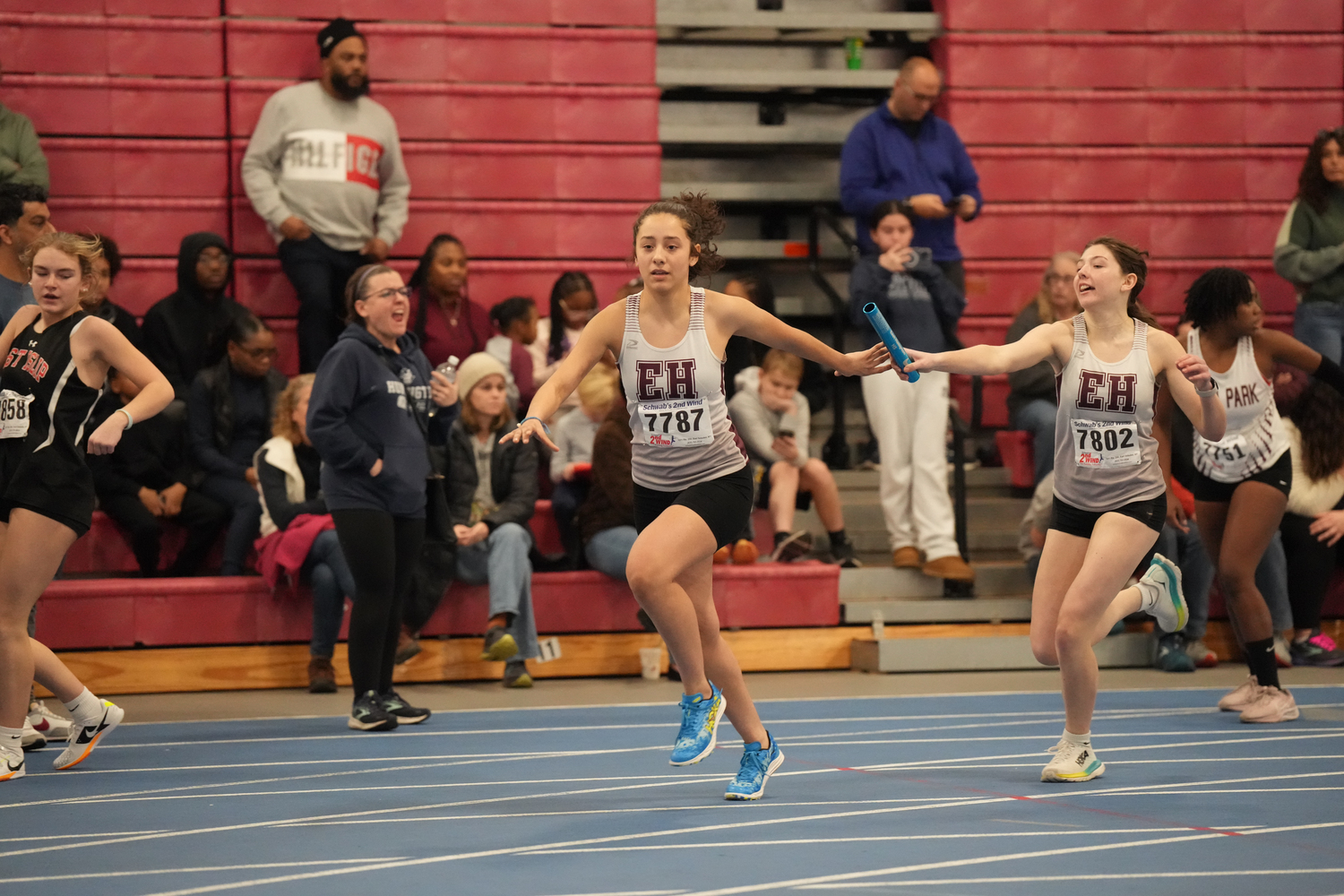 Lily Remy handing off to Fiorella Duran in the 4x200-meter relay.    RON ESPOSITO