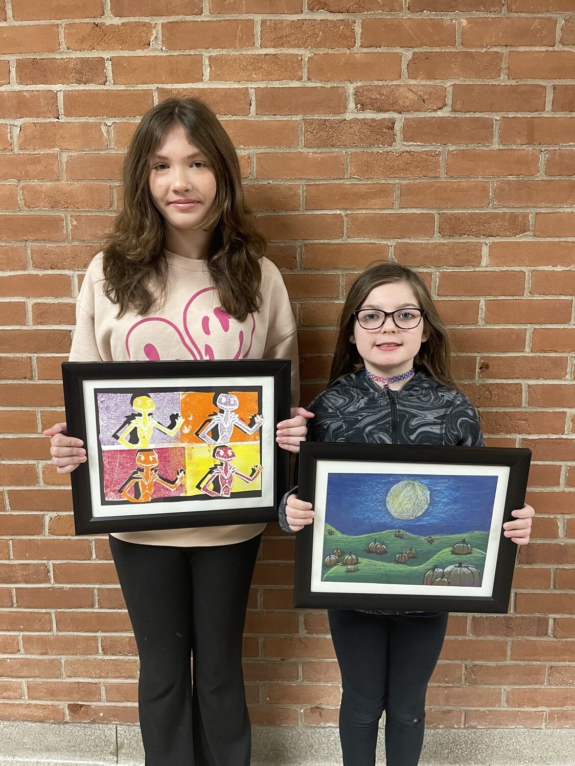 The artwork of Eastport Elementary School sixth-grader Abigail Dosiak and third-grader Grace Smith was selected for exhibit in the Colors of Long Island: Student Expressions Exhibition at the Long Island Museum in Stony Brook. COURTESY EASTPORT-SOUTH MANOR SCHOOL DISTRICT