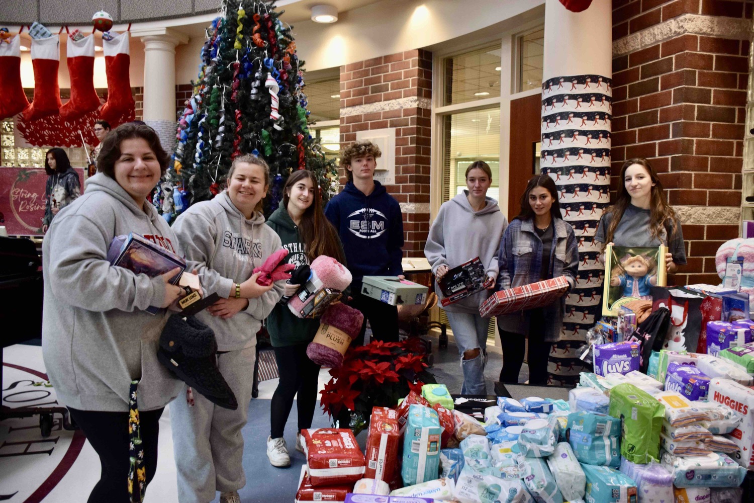 Eastport-South Manor Jr.-Sr. High School classes and clubs united in their efforts to
assist community organizations during the holiday season by hosting the school’s annual
Stuff-A-School Project.  Throughout the month, nonperishable food, clothing, arts and crafts, toiletries, baby items and more were collected for those in need and displayed in the rotunda. In recognition of the students’ and community’s hard work and generosity, members of the
performing arts groups performed throughout the day, with holiday music and cheer
resonating throughout the school hallways in preparation of the impending holiday. COURTESY EASTPORT-SOUTH MANOR SCHOOL DISTRICT