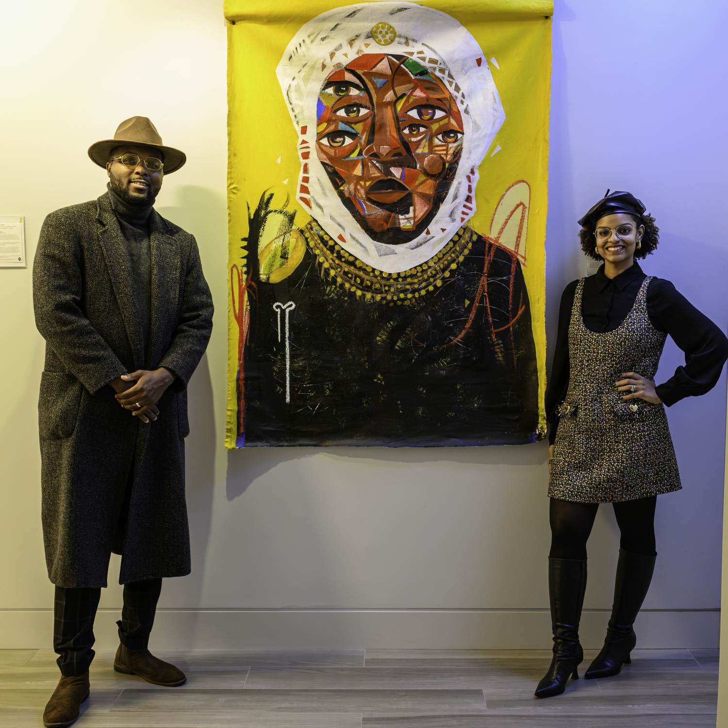 Curators Frank and Kilisi Bold with Naderson Saint-Pierre's painting 