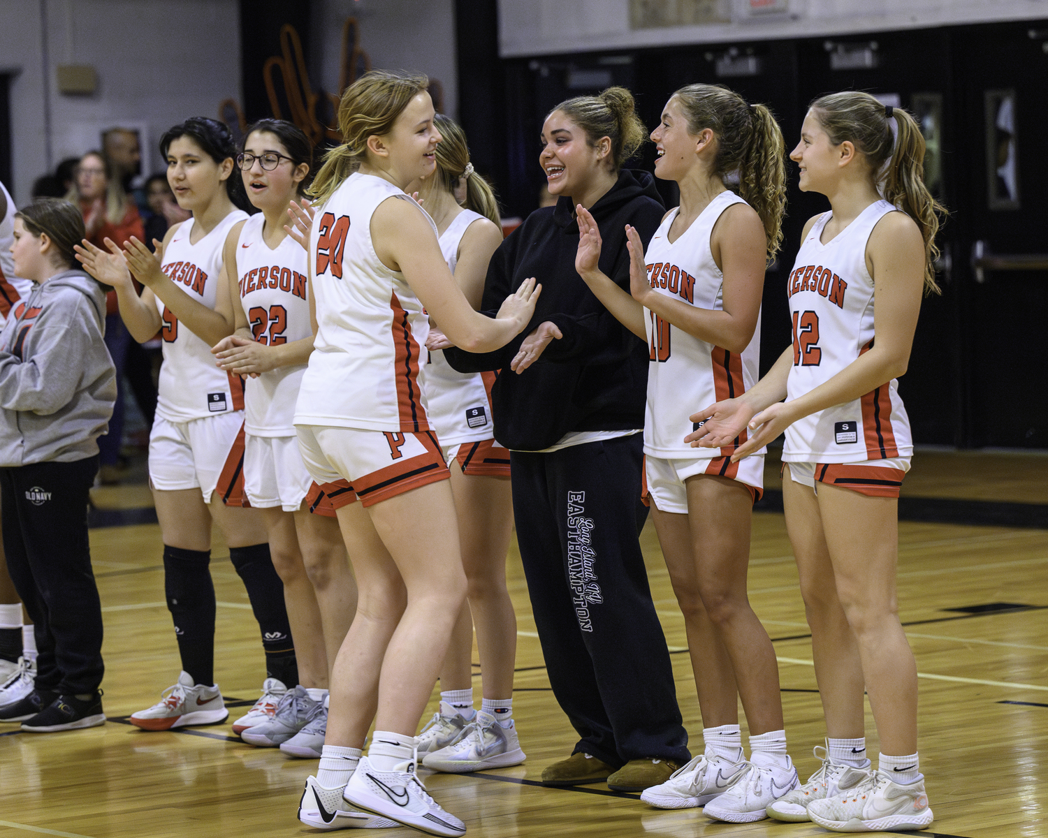 The Pierson/Bridgehampton girls basketball team goes through its player introductions on Spirit Night Friday night.    MARIANNE BARNETT