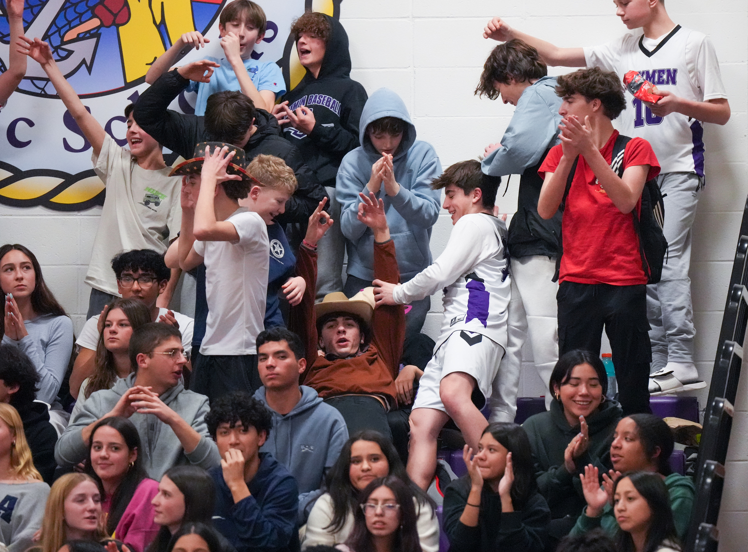 The Hampton Bays student section reacts to a made three-pointer.   RON ESPOSITO