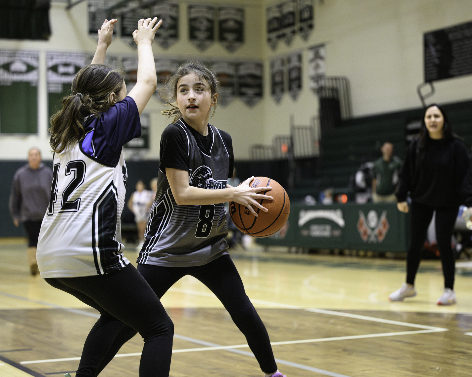 Local Hamptons Youth Athletic League basketball players faced off during halftime of Westhampton Beach's girls basketball game Friday, January 19. MARIANNE BARNETT