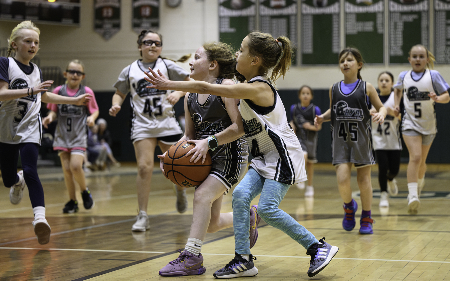 Local Hamptons Youth Athletic League basketball players faced off during halftime of Westhampton Beach's girls basketball game Friday, January 19. MARIANNE BARNETT