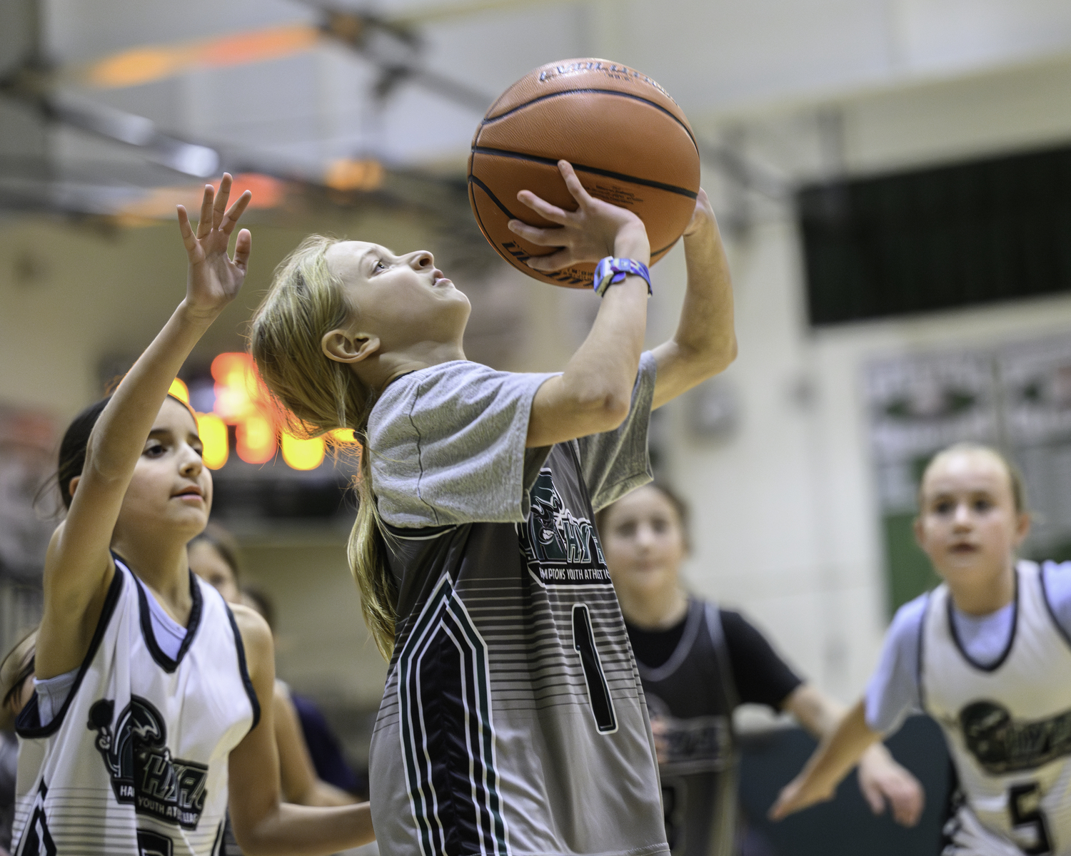Local Hamptons Youth Athletic League basketball players faced off during halftime of Westhampton Beach's girls basketball game Friday, January 19. MARIANNE BARNETT