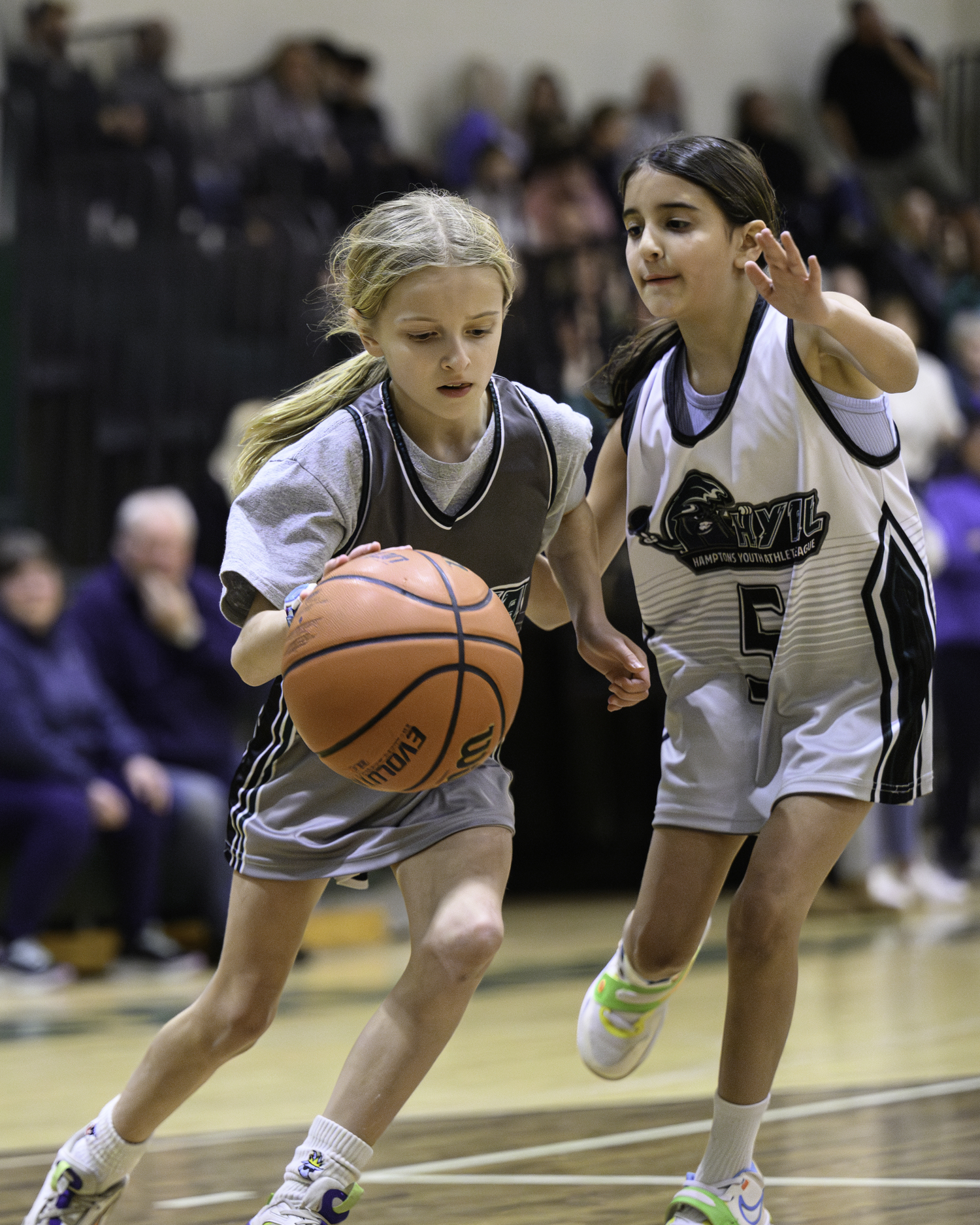 Local Hamptons Youth Athletic League basketball players faced off during halftime of Westhampton Beach's girls basketball game Friday, January 19. MARIANNE BARNETT
