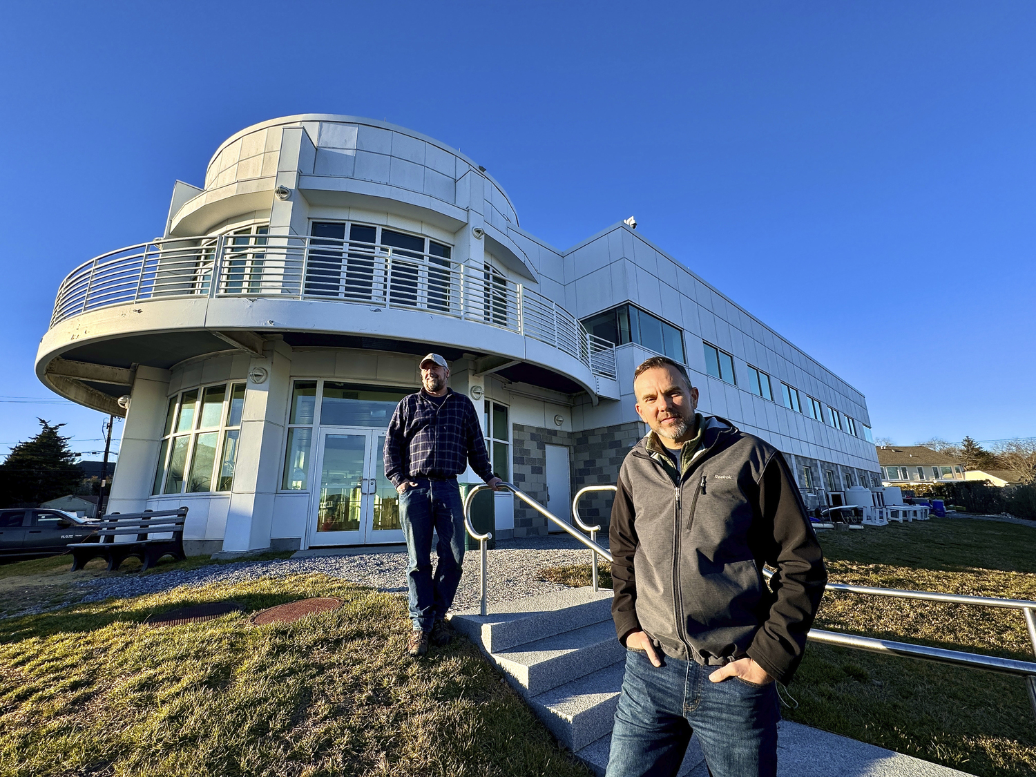 Stony Brook Marine Science Center Manager Chris Paparo and Professor Christopher Gobler, Ph.D., at the marine center. MICHAEL WRIGHT