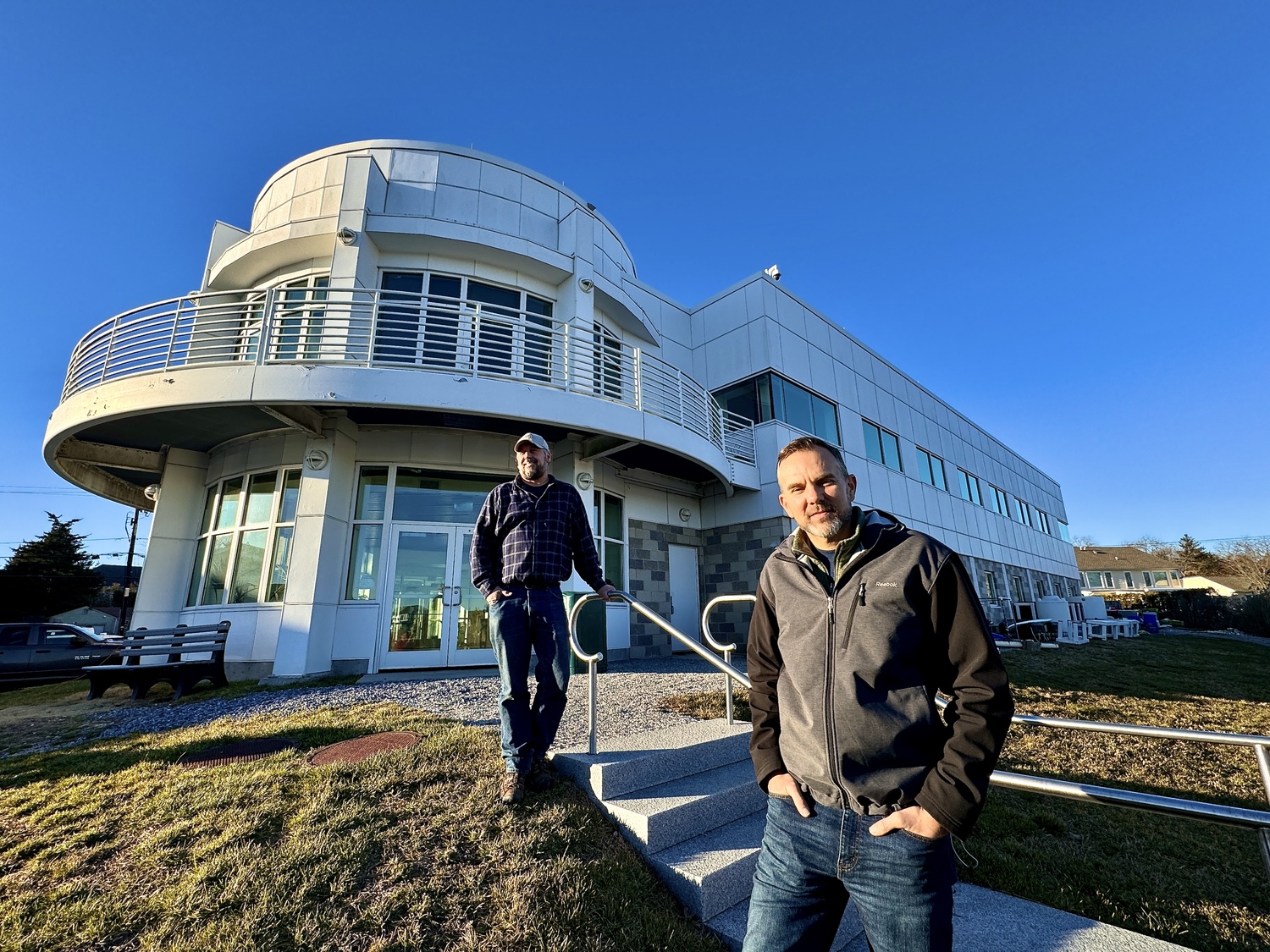 Stony Brook Marine Science Center Manager Chris Paparo and Professor Christopher Gobler, Ph.D., at the marine center. MICHAEL WRIGHT
